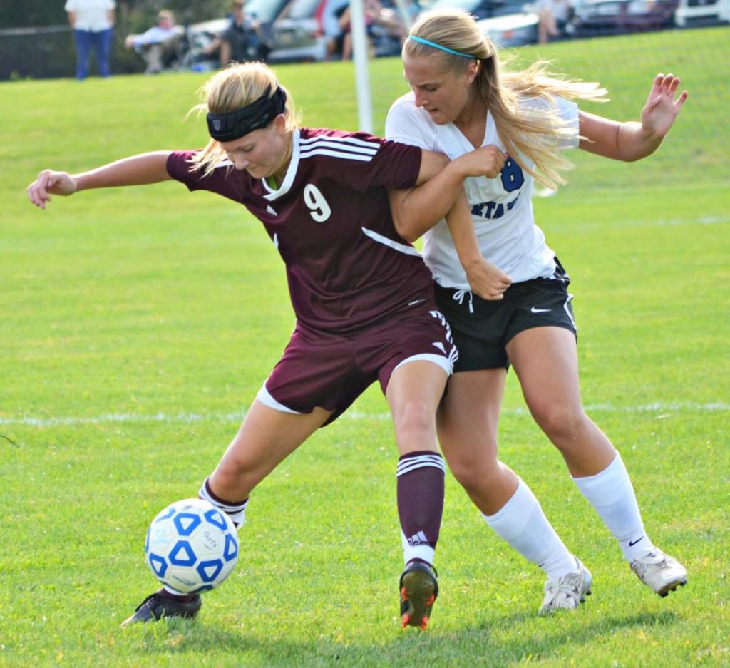 A member of the Southern Lehigh girls soccer team takes on an opponent.