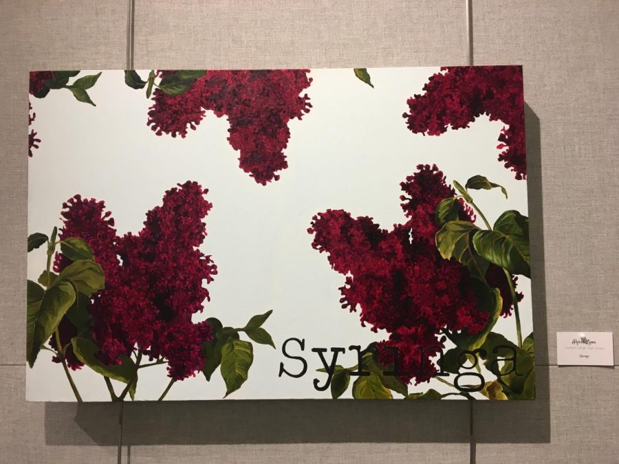 Junior Alyssa Lyon painted lilacs for the display.