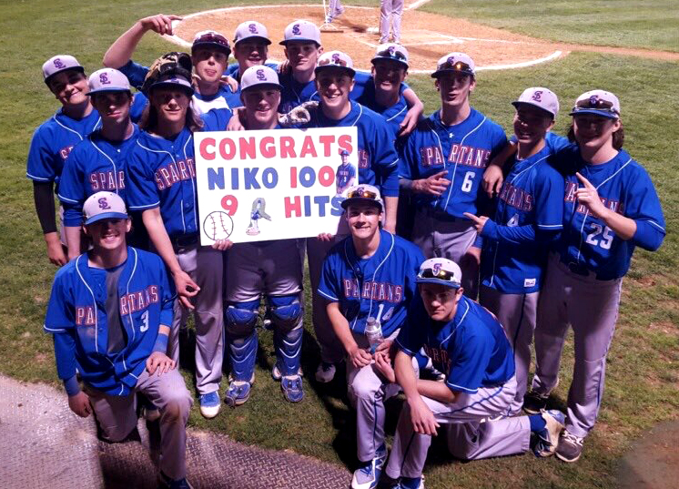 The baseball team celebrates star catcher Niko Amory’s 100th hit.