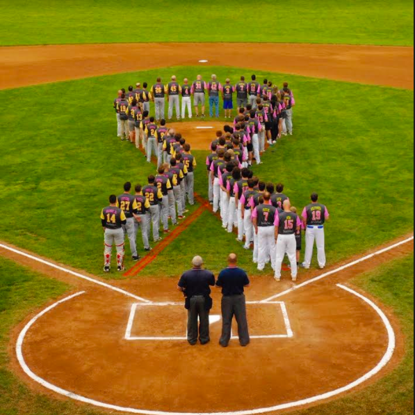 Members of rival teams Southern Lehigh and Saucon Valley came together to form a cancer ribbon on the field.