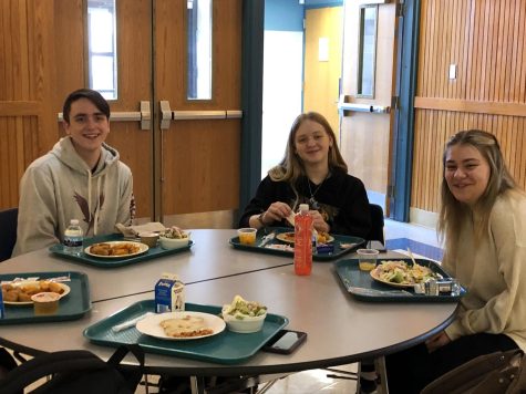 Seniors Johnathan Zbyszinski, Megan Hummel, and Brylee Trinkle take advantage of the new senior cafe tables to enjoy their lunch together.