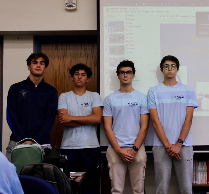 Andreas Tantaros, Zain Al Din Shamasseen, Dean Myers, and Gregory Rubino (L to R) give their introductory slideshow on the first meeting of the club.