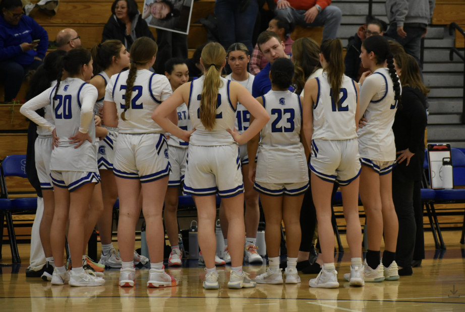 Southern Lehigh girls’ basketball in a huddle up during the game. 