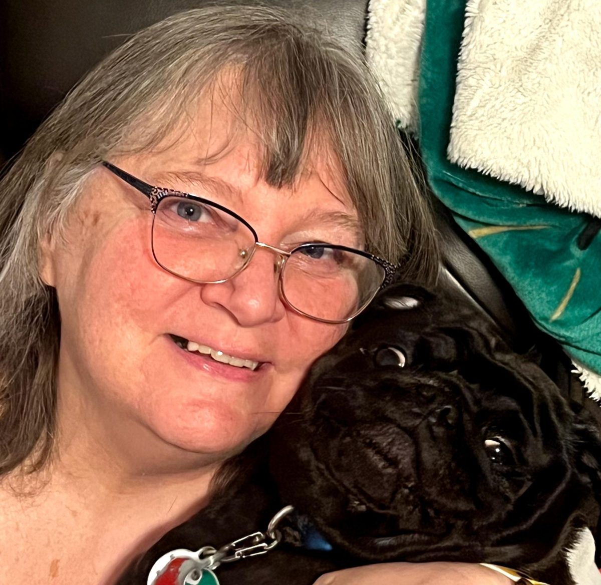 Mrs. Davis is excited to spend more time with her pug Onyx after retirement. 